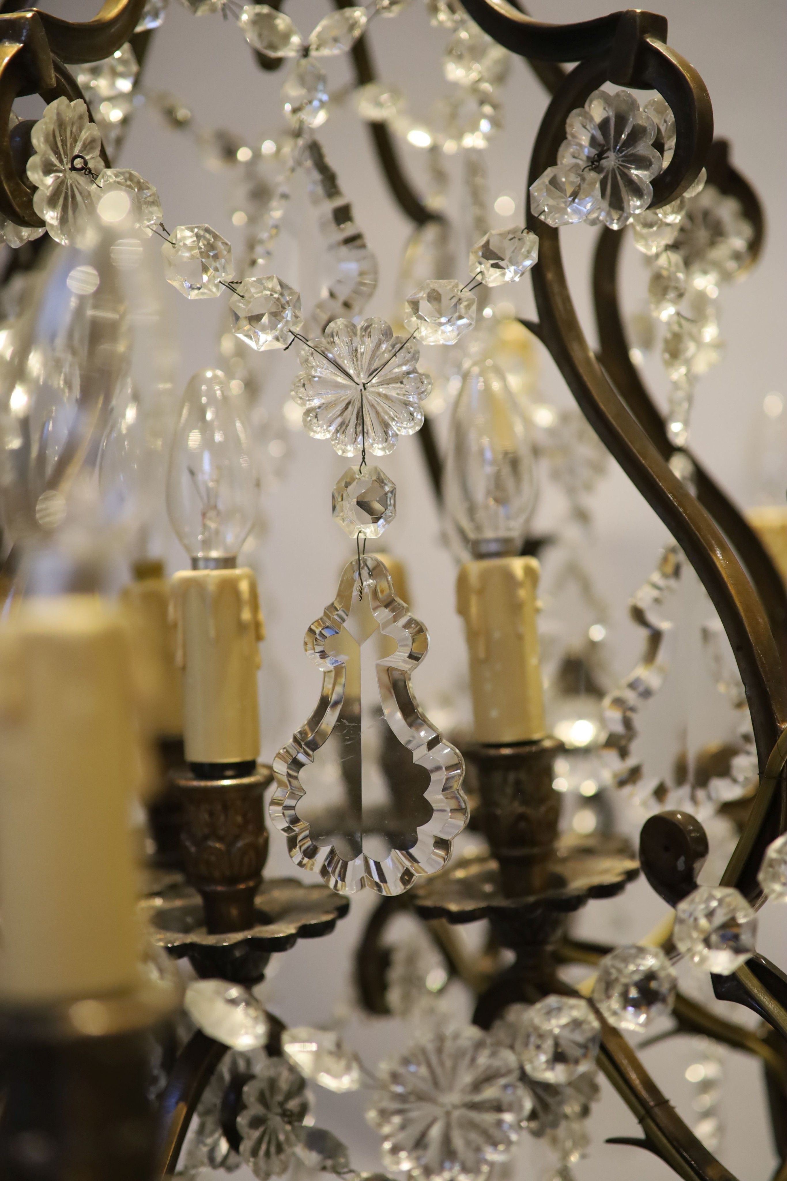 An 18th century style bronzed metal, cut glass 30 light chandelier by Christopher Wray, approximately 123 cm high